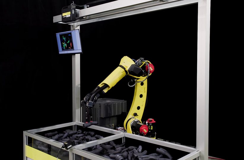 Robotic system handling and sorting parcels on a conveyor